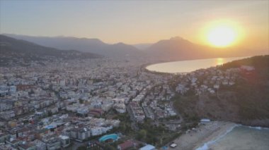 This stock footage shows aerial view of Alanya, Turkey - a resort town on the seashore in 8K resolution