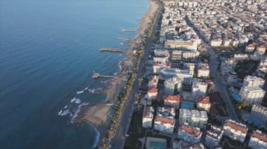 This stock footage shows aerial view of Alanya, Turkey - a resort town on the seashore in 8K resolution