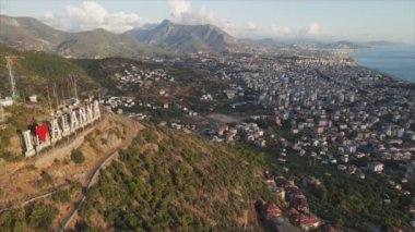 This stock footage shows aerial view of Alanya, Turkey - a resort town on the seashore in 8K resolution