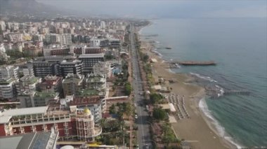 This stock footage shows aerial view of Alanya, Turkey - a resort town on the seashore in 8K resolution