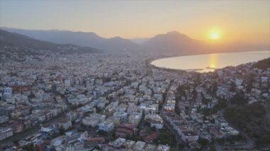 This stock footage shows aerial view of Alanya, Turkey - a resort town on the seashore in 8K resolution