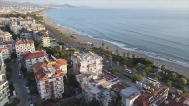This stock footage shows aerial view of Alanya, Turkey - a resort town on the seashore in 8K resolution