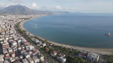 This stock footage shows aerial view of Alanya, Turkey - a resort town on the seashore in 8K resolution