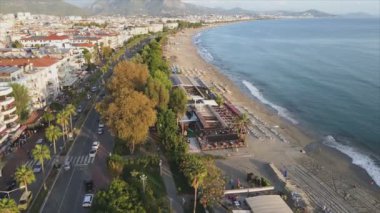 This stock footage shows aerial view of Alanya, Turkey - a resort town on the seashore in 8K resolution