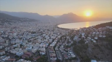 This stock footage shows aerial view of Alanya, Turkey - a resort town on the seashore in 8K resolution