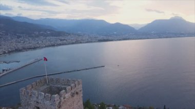 This stock footage shows aerial view of Alanya, Turkey - a resort town on the seashore in 8K resolution