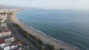 This stock footage shows aerial view of Alanya, Turkey - a resort town on the seashore in 8K resolution