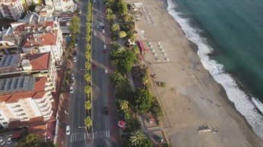 This stock footage shows aerial view of Alanya, Turkey - a resort town on the seashore in 8K resolution