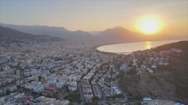 This stock footage shows aerial view of Alanya, Turkey - a resort town on the seashore in 8K resolution