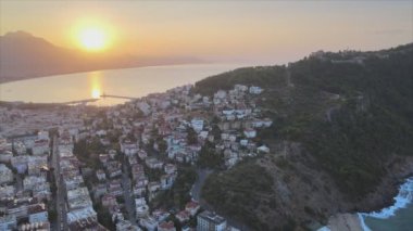 This stock footage shows aerial view of Alanya, Turkey - a resort town on the seashore in 8K resolution