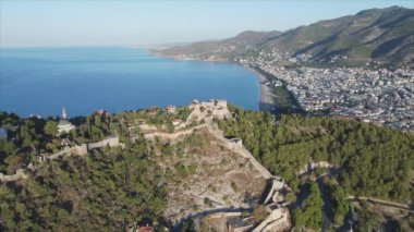 This stock footage shows aerial view of Alanya, Turkey - a resort town on the seashore in 8K resolution