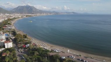This stock footage shows aerial view of Alanya, Turkey - a resort town on the seashore in 8K resolution