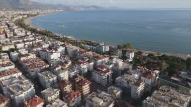 This stock footage shows aerial view of Alanya, Turkey - a resort town on the seashore in 8K resolution