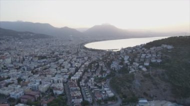 This stock footage shows aerial view of Alanya, Turkey - a resort town on the seashore in 8K resolution