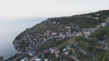 This stock footage shows aerial view of Alanya, Turkey - a resort town on the seashore in 8K resolution