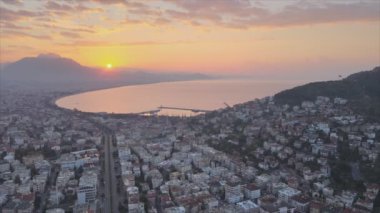 This stock footage shows aerial view of Alanya, Turkey - a resort town on the seashore in 8K resolution