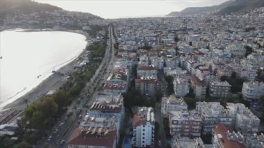 This stock footage shows aerial view of Alanya, Turkey - a resort town on the seashore in 8K resolution