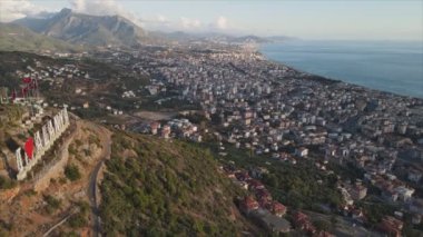 This stock footage shows aerial view of Alanya, Turkey - a resort town on the seashore in 8K resolution