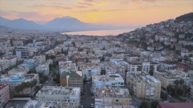 This stock footage shows aerial view of Alanya, Turkey - a resort town on the seashore in 8K resolution