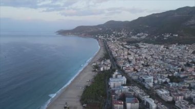 This stock footage shows aerial view of Alanya, Turkey - a resort town on the seashore in 8K resolution