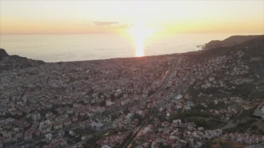 This stock footage shows aerial view of Alanya, Turkey - a resort town on the seashore in 8K resolution