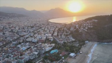 This stock footage shows aerial view of Alanya, Turkey - a resort town on the seashore in 8K resolution
