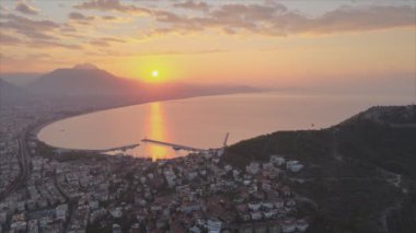 This stock footage shows aerial view of Alanya, Turkey - a resort town on the seashore in 8K resolution