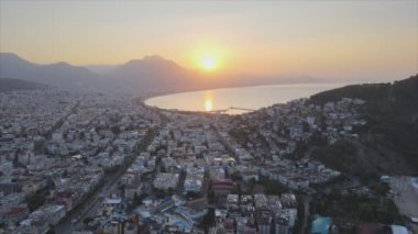 This stock footage shows aerial view of Alanya, Turkey - a resort town on the seashore in 8K resolution