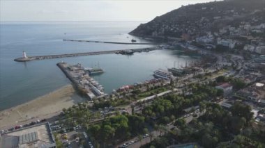 This stock footage shows aerial view of Alanya, Turkey - a resort town on the seashore in 8K resolution