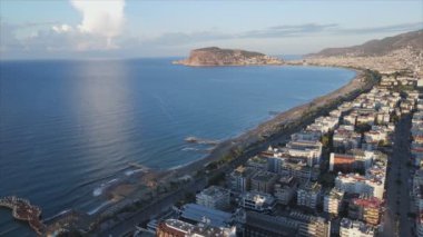 This stock footage shows aerial view of Alanya, Turkey - a resort town on the seashore in 8K resolution