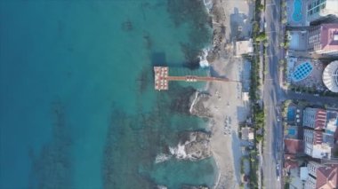 This stock footage shows aerial view of Alanya, Turkey - a resort town on the seashore in 8K resolution