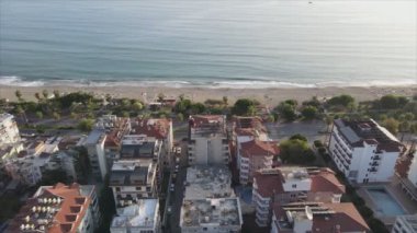 This stock footage shows aerial view of Alanya, Turkey - a resort town on the seashore in 8K resolution