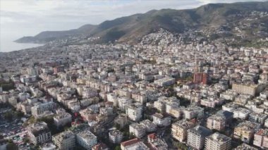 This stock footage shows aerial view of Alanya, Turkey - a resort town on the seashore in 8K resolution