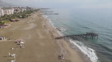 This stock footage shows aerial view of Alanya, Turkey - a resort town on the seashore in 8K resolution