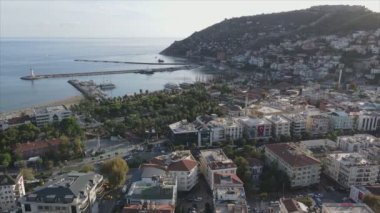 This stock footage shows aerial view of Alanya, Turkey - a resort town on the seashore in 8K resolution