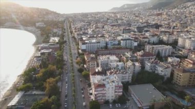 This stock footage shows aerial view of Alanya, Turkey - a resort town on the seashore in 8K resolution