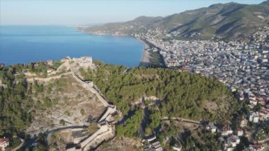 This stock footage shows aerial view of Alanya, Turkey - a resort town on the seashore in 8K resolution