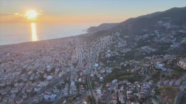 This stock footage shows aerial view of Alanya, Turkey - a resort town on the seashore in 8K resolution