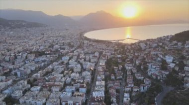 This stock footage shows aerial view of Alanya, Turkey - a resort town on the seashore in 8K resolution