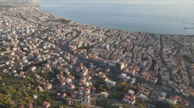 This stock footage shows aerial view of Alanya, Turkey - a resort town on the seashore in 8K resolution