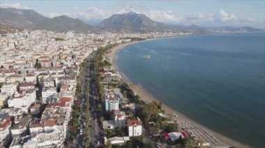 This stock footage shows aerial view of Alanya, Turkey - a resort town on the seashore in 8K resolution