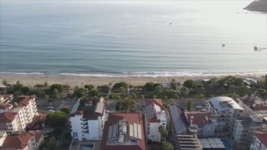 This stock footage shows aerial view of Alanya, Turkey - a resort town on the seashore in 8K resolution