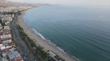 This stock footage shows aerial view of Alanya, Turkey - a resort town on the seashore in 8K resolution