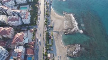This stock footage shows aerial view of Alanya, Turkey - a resort town on the seashore in 8K resolution