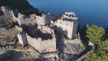 This stock footage shows aerial view of Alanya Castle, Alanya Kalesi in Turkey in 8K