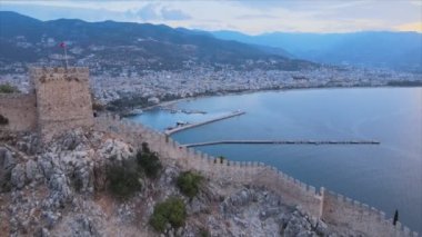 This stock footage shows aerial view of Alanya Castle, Alanya Kalesi in Turkey in 8K