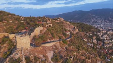 This stock footage shows aerial view of Alanya Castle, Alanya Kalesi in Turkey in 8K