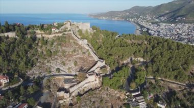 This stock footage shows aerial view of Alanya Castle, Alanya Kalesi in Turkey in 8K