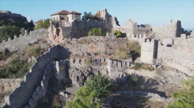 This stock footage shows aerial view of Alanya Castle, Alanya Kalesi in Turkey in 8K