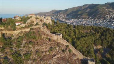 This stock footage shows aerial view of Alanya Castle, Alanya Kalesi in Turkey in 8K